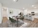 Inviting dining area featuring a modern table set with chairs, adjacent to a stylish, open kitchen design at 1212 Solace Way, Rolesville, NC 27571