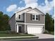 Charming two-story home with neutral siding, attached two car garage, and inviting front entrance at 1212 Solace Way, Rolesville, NC 27571