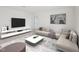 Neutral living room with contemporary furniture and decor at 1212 Solace Way, Rolesville, NC 27571