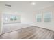 Bright, carpeted living space with large windows and a door to the back yard, perfect for entertaining at 1212 Solace Way, Rolesville, NC 27571