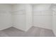 Walk-in closet featuring carpet floors and wire shelving for organized storage at 1212 Solace Way, Rolesville, NC 27571
