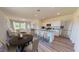 Open concept living area with kitchen, dining space, and living room with modern finishes and neutral tones at 1213 Solace Way, Rolesville, NC 27571