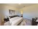 Inviting main bedroom featuring neutral tones, a large window, and an ensuite bathroom for added comfort at 1213 Solace Way, Rolesville, NC 27571