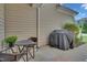 Covered back patio with outdoor seating, grill, and garden decor at 1312 Regulator St, Raleigh, NC 27603