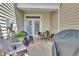 Cozy back patio with cushioned seating, outdoor rug, and grill at 1312 Regulator St, Raleigh, NC 27603