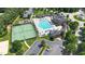 Aerial view showcases the community pool, tennis court, and clubhouse at 1312 Regulator St, Raleigh, NC 27603