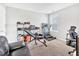 This exercise room features a treadmill, weight bench, weights and shoe rack at 1312 Regulator St, Raleigh, NC 27603