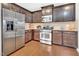 Kitchen with stainless steel appliances and wooden cabinetry at 1312 Regulator St, Raleigh, NC 27603