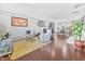 Open-concept living room featuring hardwood floors and neutral color palette at 1312 Regulator St, Raleigh, NC 27603