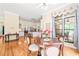 Bright breakfast nook with backyard views and seamless access to the well-lit kitchen at 1317 Woodgate Manor Ct, Raleigh, NC 27614