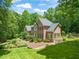 Spacious home with landscaped yard, a fenced backyard, and a picturesque setting surrounded by mature trees at 1317 Woodgate Manor Ct, Raleigh, NC 27614