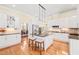 Open kitchen with island seating offers a seamless flow to the dining area at 1317 Woodgate Manor Ct, Raleigh, NC 27614