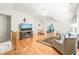 Open-concept living room with hardwood floors and views into other rooms of the home at 1317 Woodgate Manor Ct, Raleigh, NC 27614