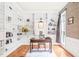 Charming home office with custom built-in bookshelves, hardwood floors, and designer window treatment at 1317 Woodgate Manor Ct, Raleigh, NC 27614