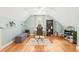 Well-lit office space with hardwood floors, a window, and ample storage at 1317 Woodgate Manor Ct, Raleigh, NC 27614