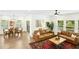 Bright, cozy living area with hardwood floors, comfy seating, and a dining area in the background at 137 Azalea View Way, Holly Springs, NC 27540