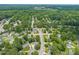 Aerial view of a residential neighborhood featuring tree-lined streets and well-maintained homes in a peaceful setting at 1409 Beckworth Ct, Garner, NC 27529