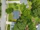 Birds-eye view of a well-maintained property with lush greenery, mature trees, and surrounding neighborhood at 1409 Beckworth Ct, Garner, NC 27529