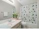 Bathroom featuring a plant on the sink, patterned shower curtain, and tiled floor at 1409 Beckworth Ct, Garner, NC 27529