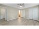 Bedroom featuring wood floors, a ceiling fan, and closet space at 1409 Beckworth Ct, Garner, NC 27529