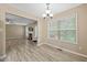 Dining room with a large window and modern lighting at 1409 Beckworth Ct, Garner, NC 27529