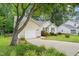 Single-story home with a garage and a well-manicured lawn at 1409 Beckworth Ct, Garner, NC 27529