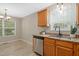 Kitchen sink with stainless steel appliances, wooden cabinets, and granite countertops at 1409 Beckworth Ct, Garner, NC 27529