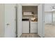 Laundry room in closet with washer, dryer, and shelves at 1409 Beckworth Ct, Garner, NC 27529