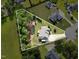 Aerial view showcasing the home's spacious lot with mature trees at 142 Crestline Dr, Selma, NC 27576