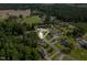 Wonderful aerial view of charming home nestled among mature trees at 142 Crestline Dr, Selma, NC 27576