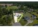 Aerial view of charming home with well-maintained landscaping and spacious yard at 142 Crestline Dr, Selma, NC 27576