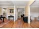 Hallway features hardwood floors and neutral walls, seamlessly connecting various living spaces at 142 Crestline Dr, Selma, NC 27576