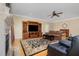 Inviting living room features a cozy fireplace, entertainment center and comfortable seating at 142 Crestline Dr, Selma, NC 27576