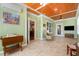 Bright sunroom with tile floors, beadboard walls and wood ceiling at 142 Crestline Dr, Selma, NC 27576