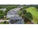 Aerial shot showing many homes next to the golf course with treelined streets at 1508 Heritage Reserve Ct, Wake Forest, NC 27587