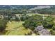 Expansive golf course community with a scenic pond surrounded by lush greenery and beautiful homes at 1508 Heritage Reserve Ct, Wake Forest, NC 27587