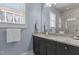 Bright bathroom showcasing gray walls, a window, and a granite vanity at 1508 Heritage Reserve Ct, Wake Forest, NC 27587
