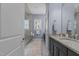Bright bathroom showcasing a glass shower, hexagon tile floors and blue walls at 1508 Heritage Reserve Ct, Wake Forest, NC 27587