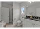 Bathroom with gray tile floors, white cabinets, and glass enclosed shower at 1508 Heritage Reserve Ct, Wake Forest, NC 27587