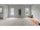 Large bedroom with windows and carpeted floors with a yoga mat and weights at 1508 Heritage Reserve Ct, Wake Forest, NC 27587