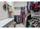 Walk-in closet showing a white chest and clothes hung on rods and shelves at 1508 Heritage Reserve Ct, Wake Forest, NC 27587