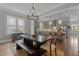 Elegant dining room connects seamlessly with a modern kitchen, creating an ideal space for entertaining and Gathering gatherings at 1508 Heritage Reserve Ct, Wake Forest, NC 27587