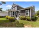 Exterior view of the home with a screened porch, patio, and well-kept lawn at 1508 Heritage Reserve Ct, Wake Forest, NC 27587