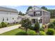 Beautifully landscaped front yard with a charming porch on a two-story home at 1508 Heritage Reserve Ct, Wake Forest, NC 27587