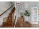 Bright hallway with hardwood floors connecting to various rooms in the house at 1508 Heritage Reserve Ct, Wake Forest, NC 27587