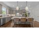 Stylish kitchen with gray cabinets, quartz countertops, and a center island with seating at 1508 Heritage Reserve Ct, Wake Forest, NC 27587