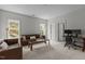 Bright, spacious living room has carpeted floors, natural light, and comfortable seating at 1508 Heritage Reserve Ct, Wake Forest, NC 27587