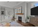 Cozy living room with a fireplace and stylish decor, providing a warm and inviting space at 1508 Heritage Reserve Ct, Wake Forest, NC 27587