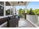Relaxing porch with comfortable seating overlooking a lush green neighborhood at 1508 Heritage Reserve Ct, Wake Forest, NC 27587