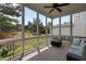 Relaxing screened porch offers a view of the backyard and features an overhead ceiling fan at 1508 Heritage Reserve Ct, Wake Forest, NC 27587